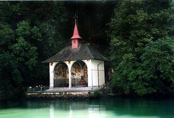 A close-up photograph of Tellsplatte on the shores of Lake Lucerne. Tellsplatte is the spot that legend says William Tell escaped from his captors and landed back on Swiss shores.
