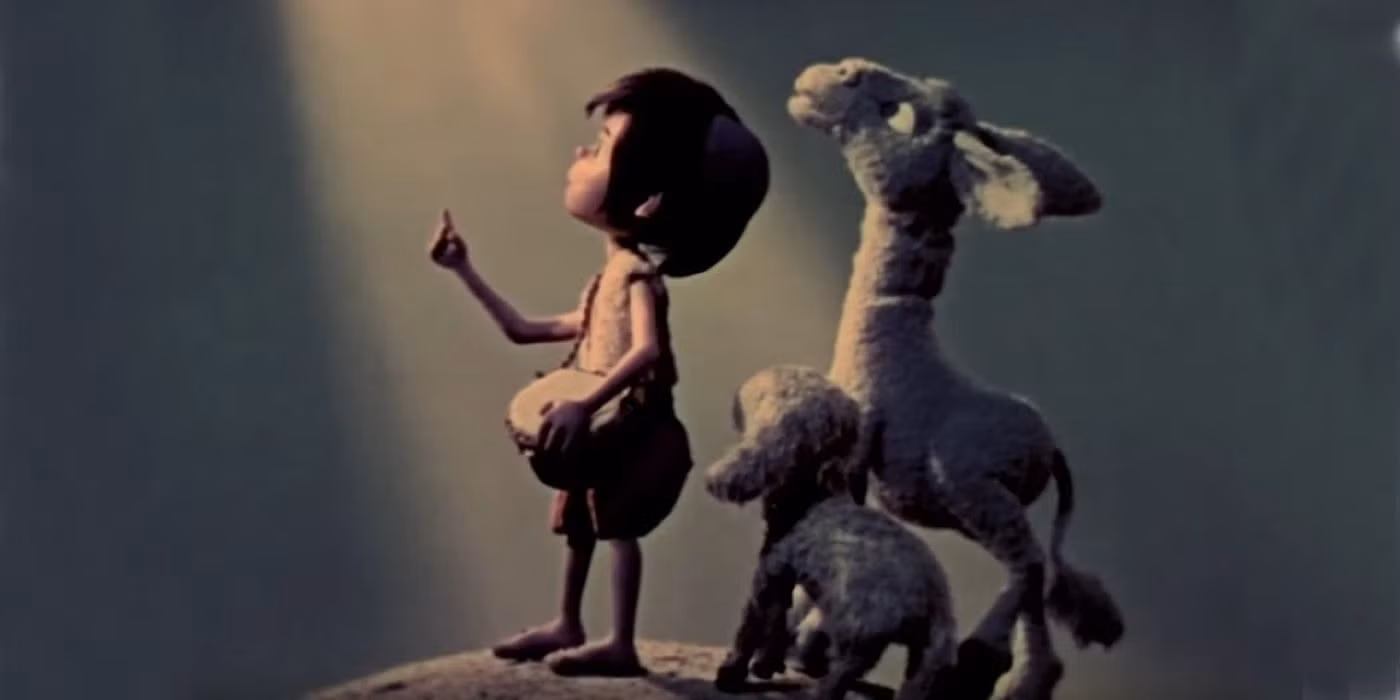 A screen shot from the animated movie "The Little Drummer Boy" from 1969. The shot shows the little drummer boy and various animals that would have been around the stable where the Baby Jesus was born, all staring off in to the heavens.